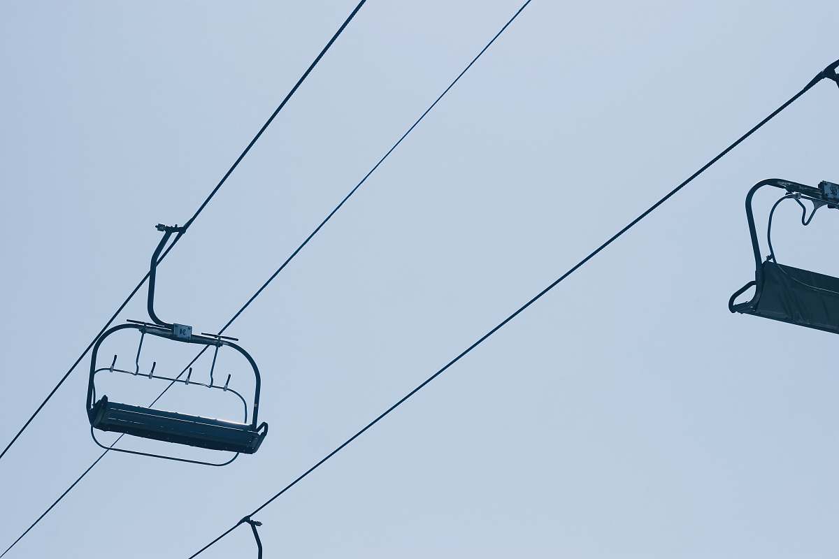 cable car cable bench under blue sky transportation